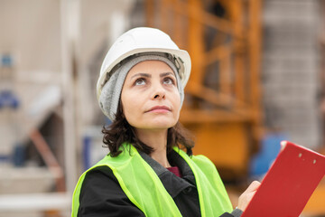 technician female working with helmet outside