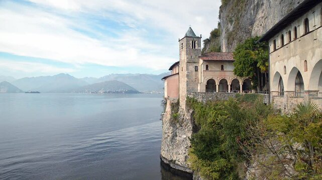 Lake Maggiore, Italy. Eremo di  Santa Caterina del Sasso (Hermitage of Saint Catherine of stone - XIII cen) overhanging a big European lake. Fascinating historical site of the lake Maggiore