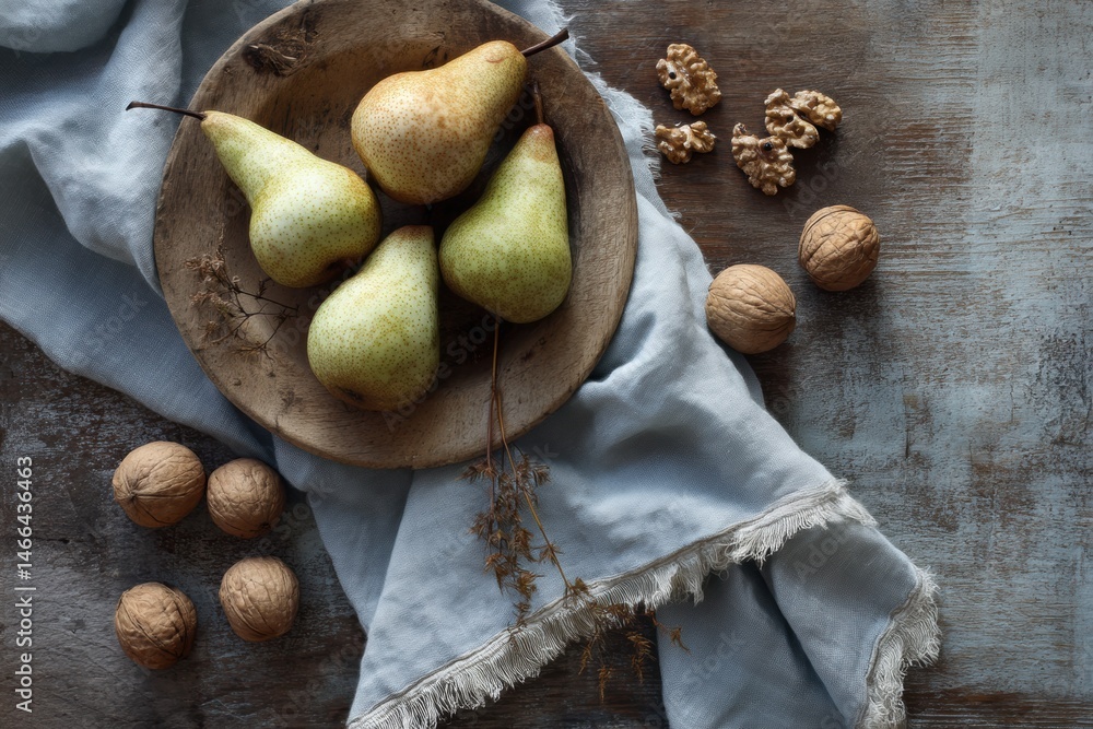 Poster rustic table setting with fresh pears, walnuts, and a soft linen napkin for a cozy autumn gathering 
