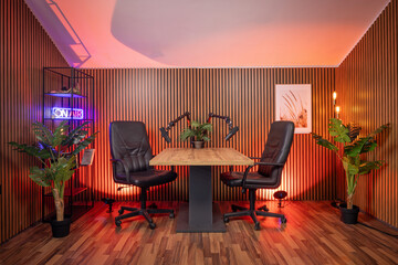 Creative podcast studio with pro lighting setup for broadcasting and streaming.