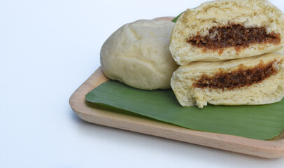 Baozi or bakpao is a Chinese Steamed Bread which is a type of yeast filled bun used in various Chinese dishes.