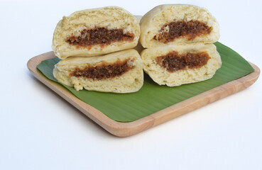 Baozi or bakpao is a Chinese Steamed Bread which is a type of yeast filled bun used in various Chinese dishes.