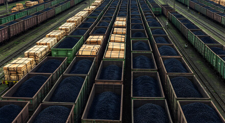 Fototapeta premium Freight Cars Loaded with Coal in Rows Aerial View of Industrial Transportation