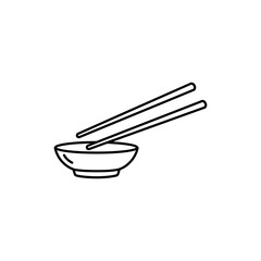 Chopsticks Resting on Sauce Dish Crosswise - Asian Cuisine