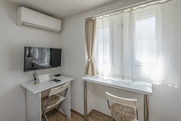 Bright minimalist workspace with TV