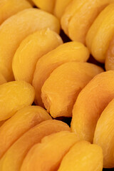 dried pitted apricots are yellow in color, a lot of dried apricots are dehydrated after removing the seeds