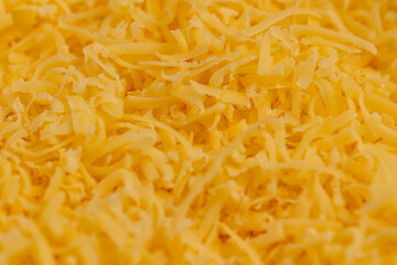 grated cheese of yellow color, grated cheese preparation for adding to dishes
