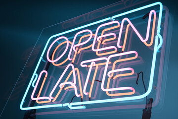 Neon sign displaying "Open Late" in pink and orange lettering within a blue neon frame, showcasing a vibrant, modern aesthetic symbolizing extended business hours and nightlife