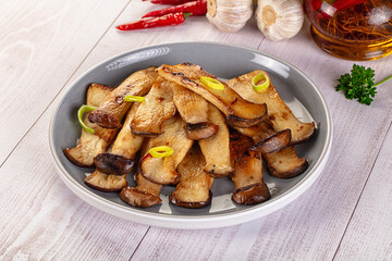 Roasted eringi mushrooms in the plate