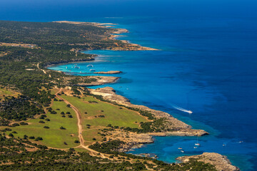 Fototapeta premium Picturesque aerial view of coastline at Fountain Amoros. Natural rock formations, clear waters create an atmosphere of secluded beauty. Travel, vacation