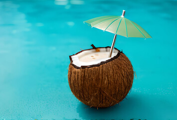 drink in coconut with steam and straw on beach background.generative ai