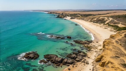 Obraz premium Aerial view of serene turquoise ocean waters meeting sandy coastline and cliffs