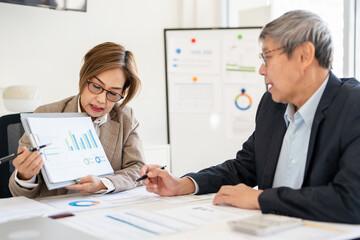 Obraz premium Co working conference, Business team meeting present, investor colleagues discussing new plan financial graph data on office table with calculator, Finance, accounting, investment.