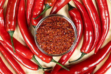 Ground Chili Seasoning and Fresh Chili Peppers Top View.