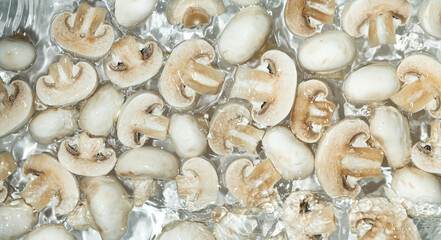 Raw White Mushrooms Champignons Close-Up Splash in a Water Top View