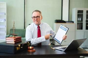 Fototapeta premium Male judge in courtroom, lawyer working in office. Perfect for business, legal advice, corporate law