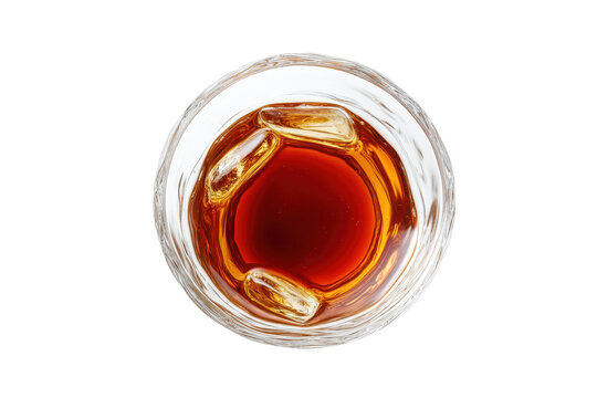 Amber elixir A glass of whiskey on ice topdown