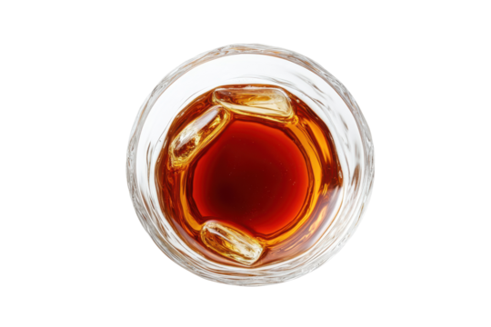 Amber elixir A glass of whiskey on ice topdown