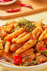 Spicy chicken feet, served with drinks on the table