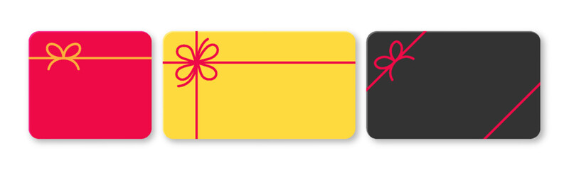Obraz premium Set of blank colored gift cards with decorative bows, ideal for sales events, bonus offers, or certificates. Includes black, red, and yellow cards viewed from the top on a white background.