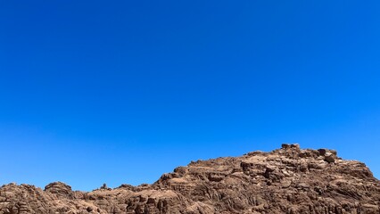 Mountain landscape with blue sky. Copy space.