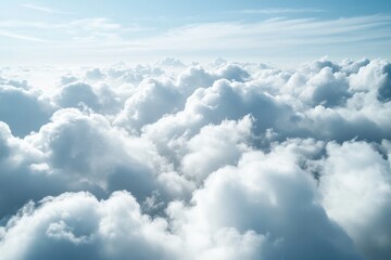 Aerial view of fluffy white clouds under a bright blue sky during a sunny day