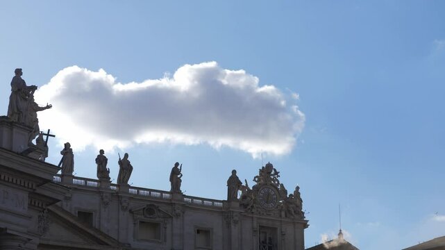 Rome, Italy - May 8, 2025: White smoke rises clearly from the Sistine Chapel chimney, confirming the election of the new pope as the crowd in St Peter&rsquo;s Square reacts.
