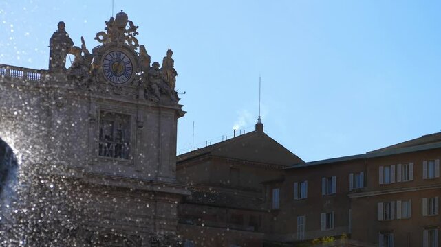 Rome, Italy - May 8, 2025: A clear column of white smoke emerges from the Sistine Chapel chimney, rising over the rooftops of the Vatican and confirming a new pope has been chosen.
