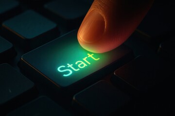 Close-up of a glowing 'Start' button being pressed on a keyboard.