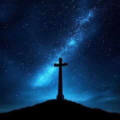 Majestic cross standing tall on a hill overlooking a beautiful expansive landscape below