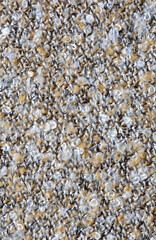 Close up of a carpet with a lot of white and brown fibers