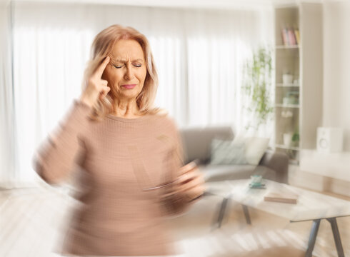Woman suffering from a headache and feeling dizzy