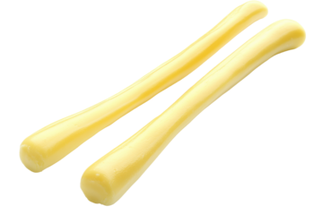 Two string cheese sticks glow softly against black