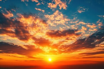 Obraz premium Vibrant sunset sky with dramatic orange clouds over horizon