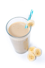 Fresh and healthy banana smoothie in glass isolated on white background
