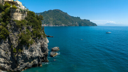 Fototapeta premium Aerial view of the Amalfi Coast, in the province of Salerno, Campania, Italy. This coastal panorama is one of the most beautiful and touristic on the Italian peninsula. 