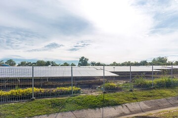 Fototapeta premium Solar panels in a solar power plant with a clear sky