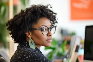 African American Woman Decluttering Her Office Space for Better Productivity