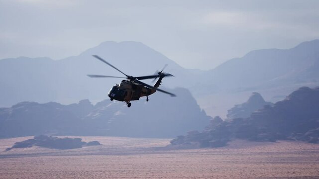 following slowmotion of black hawk helicopter in wadi rum desert
