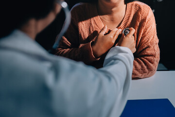 The doctor examines the patient's heart to analyze and listen to whether the heart rhythm is...