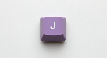 Purple keyboard key with the letter J on a white background