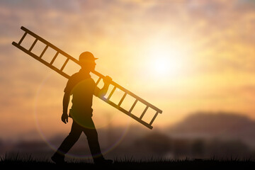 Engineer Silhouette Carrying Ladder at Sunset