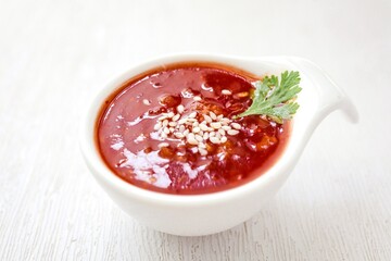 Sukiyaki sauce in white bowl on white background