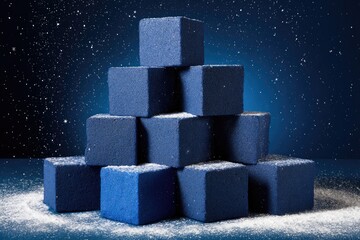 Blue blocks stacked pyramid, snowy backdrop