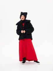Street style fashion, Asian model in faux fur clothes on white studio background.