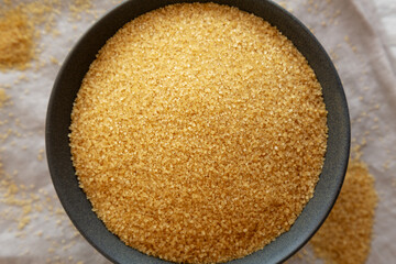 Organic Demerara Sugar in a Bowl, top view. Close-up.