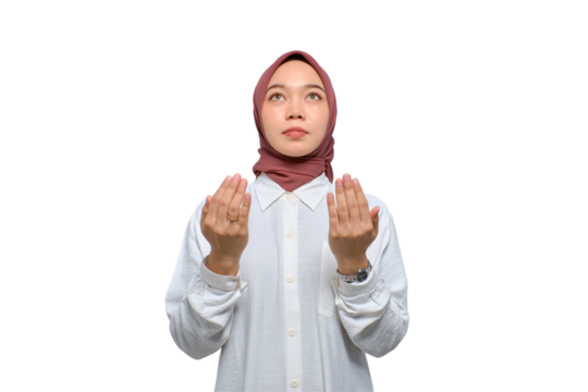 Young Asian Muslim woman raising hands and praying to god isolated on transparent background