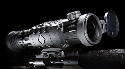 Rifle scope that allows a shooter to see in the night on a dark background