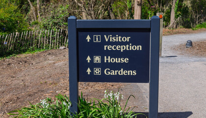 Visitor sign at country park in County Down pointing the way to various attractions
