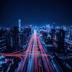 Obraz premium Aerial view of a bustling city at night with illuminated roads